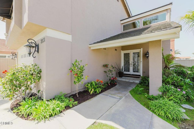 2231 Peninsula Rd, Oxnard, CA 93035 - view of exterior entry with stucco siding and french doors