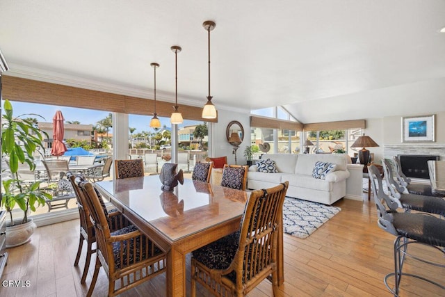 2231 Peninsula Rd, Oxnard, CA 93035 - dining area with light wood-style flooring and crown molding