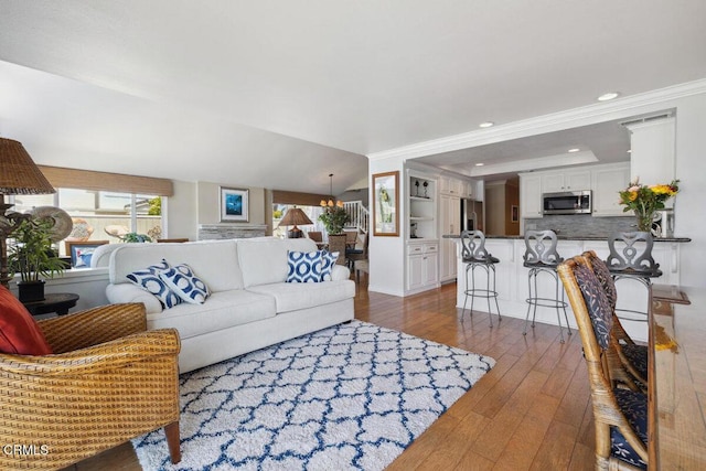 2231 Peninsula Rd, Oxnard, CA 93035 - living area with wood-type flooring, recessed lighting, and crown molding