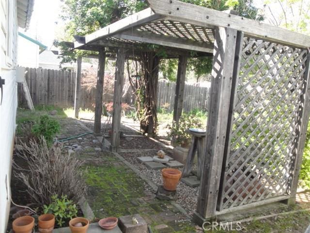 2480 Baldwin Ave, Oroville, CA 95966 - view of yard with fence and a pergola