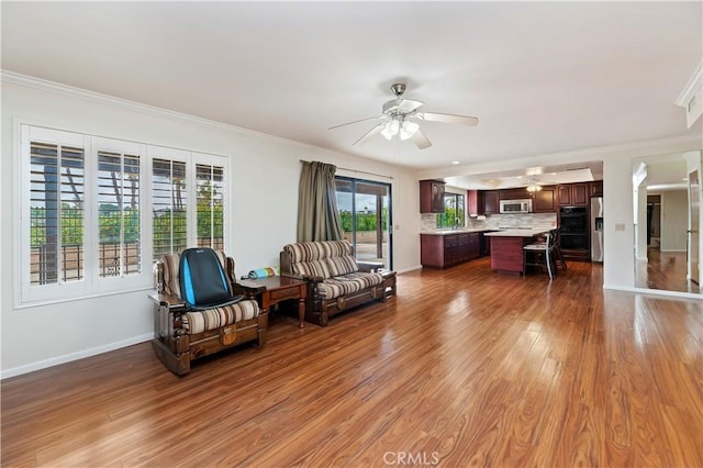 15705 Gila Way, Riverside, CA 92508 - sitting room featuring ornamental molding, ceiling fan, wood finished floors, and baseboards