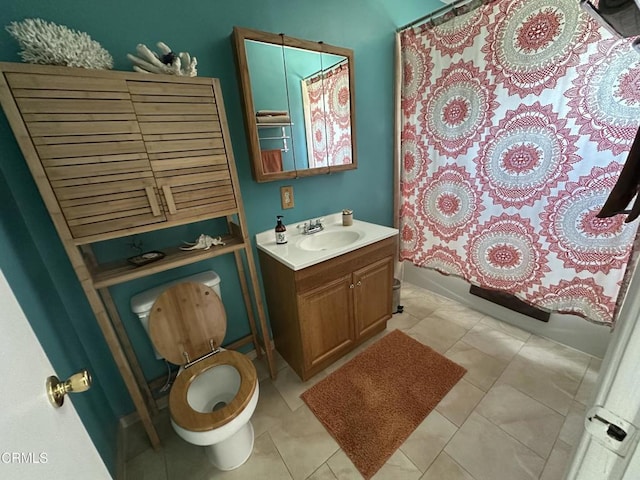 bathroom featuring tile patterned flooring, toilet, vanity, and shower / bath combination with curtain