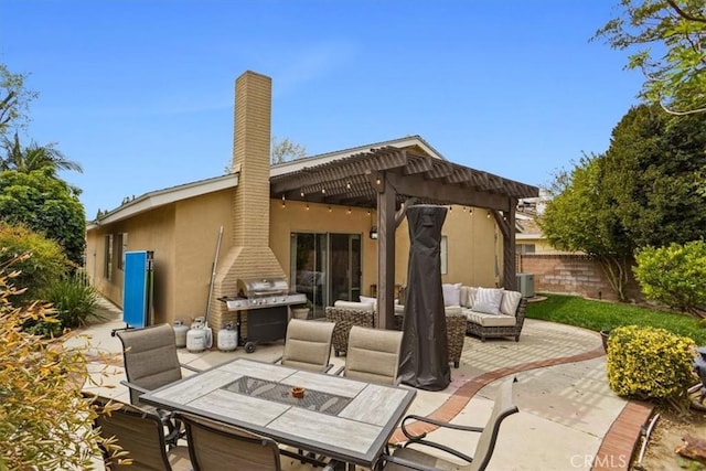 view of patio featuring outdoor dining area, outdoor lounge area, area for grilling, fence, and a pergola