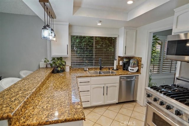 kitchen with stainless steel appliances, a sink, white cabinets, light tile patterned floors, and light stone counters