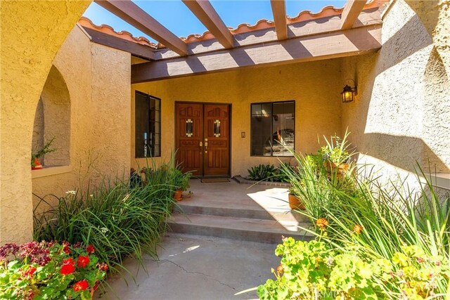5420 Clayvale St, Acton, CA 93510 - property entrance featuring stucco siding and a pergola
