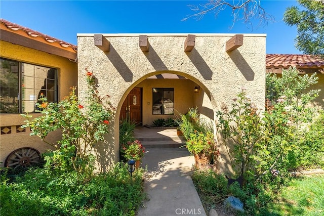 5420 Clayvale St, Acton, CA 93510 - property entrance featuring a tile roof and stucco siding