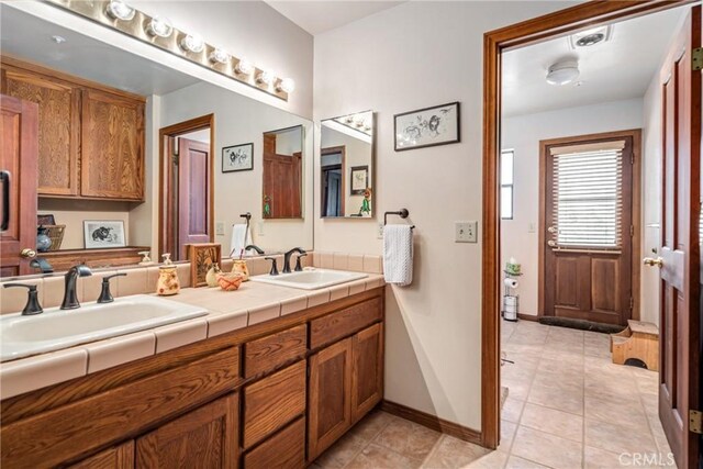 5420 Clayvale St, Acton, CA 93510 - bathroom with tile patterned flooring, double vanity, and baseboards