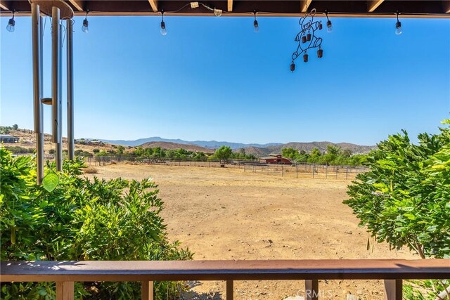 5420 Clayvale St, Acton, CA 93510 - view of yard featuring a mountain view, an outdoor riding arena, a rural view, and fence