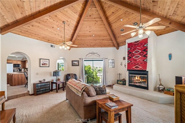 5420 Clayvale St, Acton, CA 93510 - living area with light carpet, ceiling fan, beamed ceiling, wooden ceiling, and arched walkways