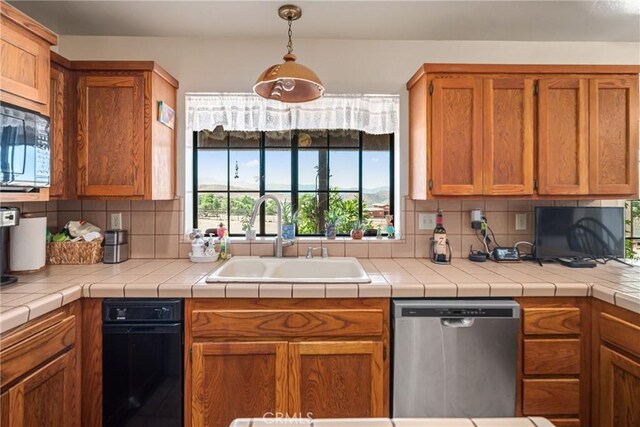 5420 Clayvale St, Acton, CA 93510 - kitchen featuring dishwasher, a sink, black microwave, tasteful backsplash, and brown cabinets