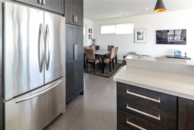 1204 Monterey Blvd, Hermosa Beach, CA 90254 - kitchen featuring freestanding refrigerator, light countertops, dark tile patterned flooring, recessed lighting, and dark brown cabinetry