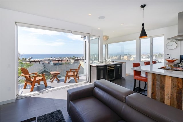 1204 Monterey Blvd, Hermosa Beach, CA 90254 - living area with wine cooler, dark tile patterned floors, and a water view