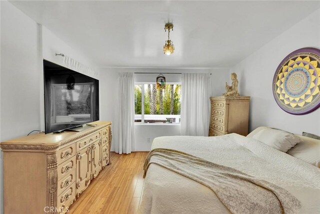 bedroom featuring light wood-type flooring
