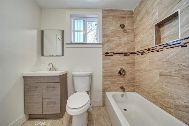 full bath featuring vanity, toilet, baseboards, bathing tub / shower combination, and wood finished floors