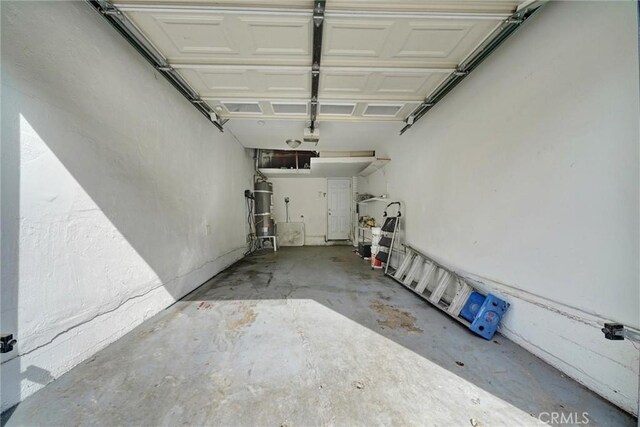 garage with strapped water heater