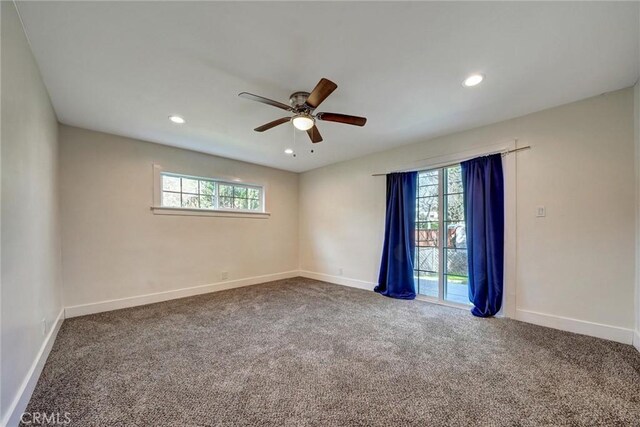 carpeted empty room with plenty of natural light, baseboards, ceiling fan, and recessed lighting