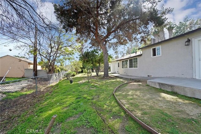 view of yard with a patio area and fence