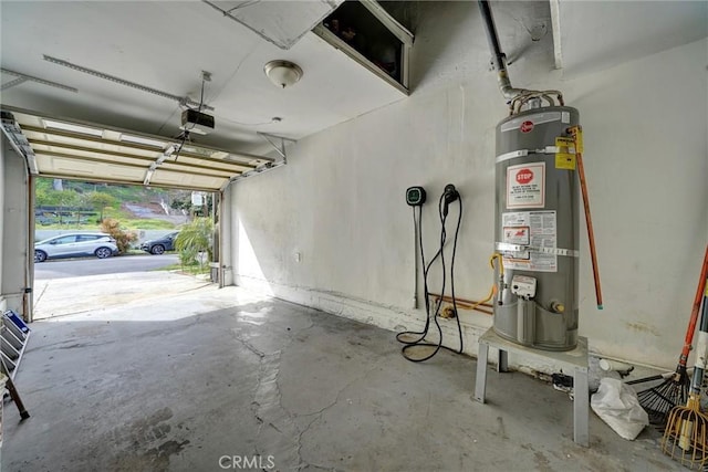 garage featuring water heater and a garage door opener