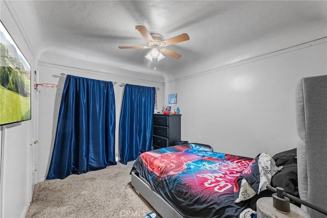 carpeted bedroom with a ceiling fan