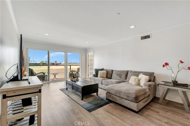 1 3rd Pl Unit 302, Long Beach, CA 90802 - living room featuring ornamental molding, light wood-style floors, recessed lighting, and baseboards