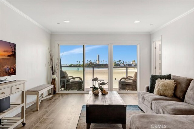 1 3rd Pl Unit 302, Long Beach, CA 90802 - living room with light wood finished floors, crown molding, and recessed lighting