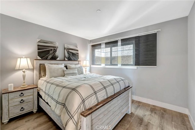 1 3rd Pl Unit 302, Long Beach, CA 90802 - bedroom featuring baseboards and wood finished floors