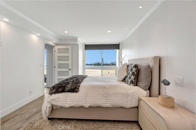 1 3rd Pl Unit 302, Long Beach, CA 90802 - bedroom featuring ornamental molding, wood finished floors, recessed lighting, baseboards, and a water view