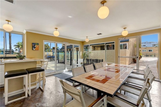 1 3rd Pl Unit 302, Long Beach, CA 90802 - dining room with crown molding, french doors, and finished concrete floors