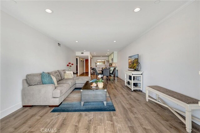 1 3rd Pl Unit 302, Long Beach, CA 90802 - living area featuring baseboards, wood finished floors, recessed lighting, and crown molding