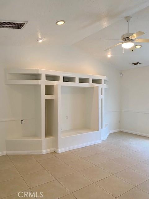 23073 Cielito Dr, Apple Valley, CA 92308 - unfurnished room with vaulted ceiling, a ceiling fan, light tile patterned floors, and recessed lighting