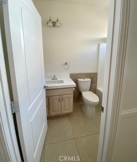 23073 Cielito Dr, Apple Valley, CA 92308 - bathroom with vanity, tile patterned floors, and a tub