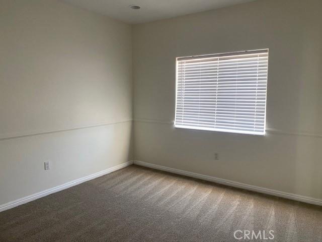 23073 Cielito Dr, Apple Valley, CA 92308 - empty room featuring carpet flooring and baseboards
