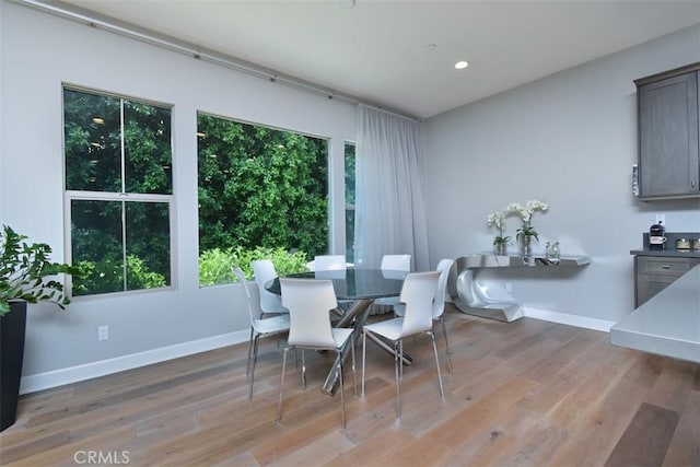 14608 Mccormick St, Sherman Oaks, CA 91411 - dining area featuring recessed lighting, wood finished floors, and baseboards