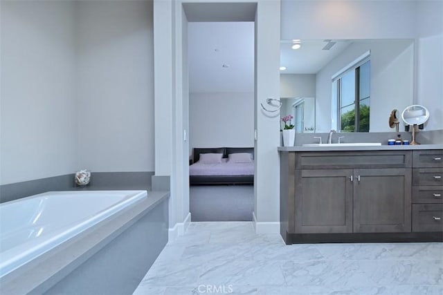14608 Mccormick St, Sherman Oaks, CA 91411 - ensuite bathroom featuring vanity, a garden tub, marble finish floors, and baseboards