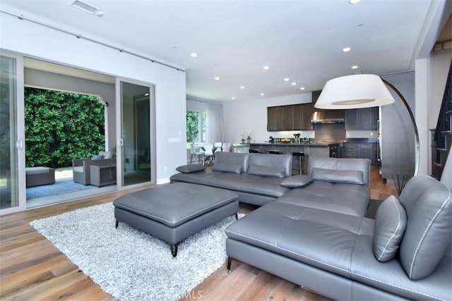 14608 Mccormick St, Sherman Oaks, CA 91411 - living room featuring recessed lighting and light wood finished floors