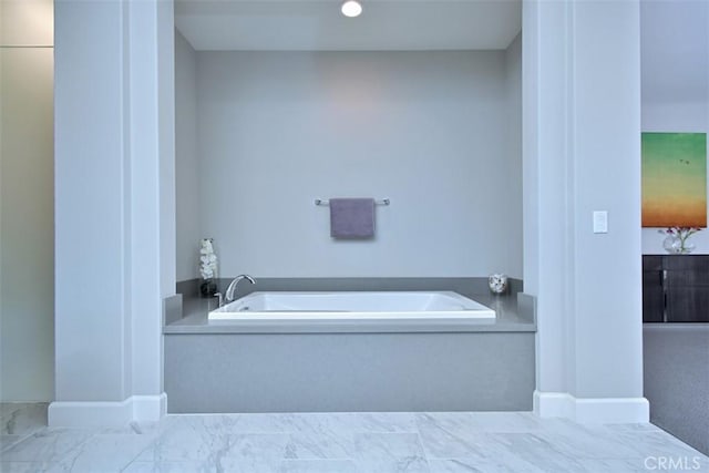 14608 Mccormick St, Sherman Oaks, CA 91411 - bathroom with a garden tub, marble look tile flooring, and baseboards