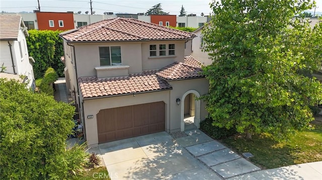 14608 Mccormick St, Sherman Oaks, CA 91411 - mediterranean / spanish-style home featuring a tile roof, stucco siding, driveway, and a garage