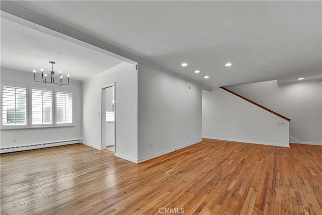 unfurnished living room featuring crown molding, a notable chandelier, a baseboard radiator, and baseboards