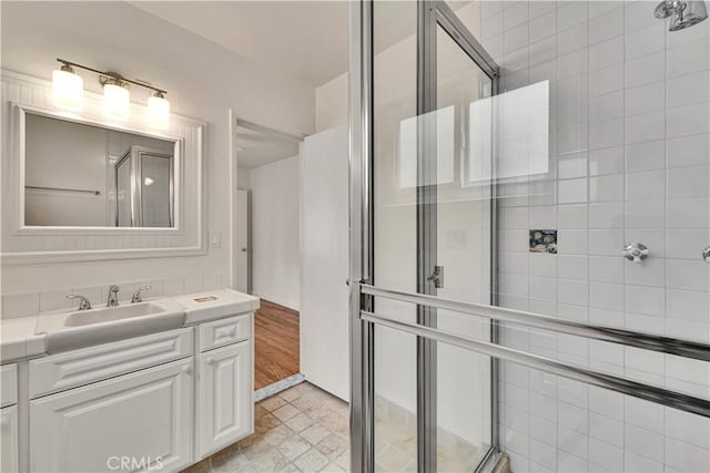 bathroom featuring vanity and a stall shower