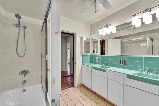 full bathroom with a sink, tile patterned flooring, and ceiling fan