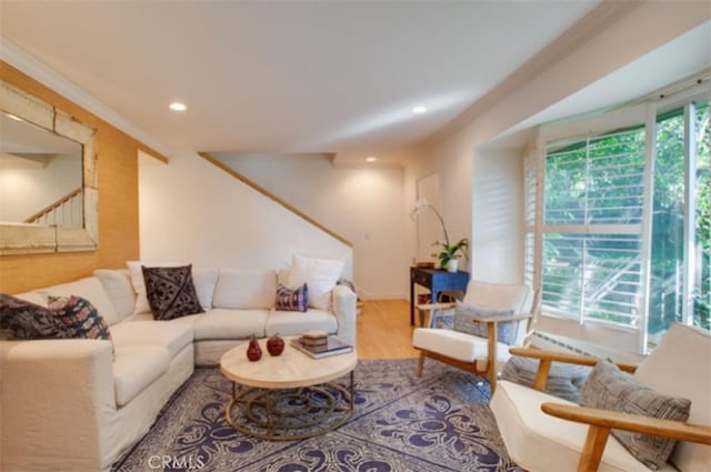 living room featuring recessed lighting, stairs, and wood finished floors