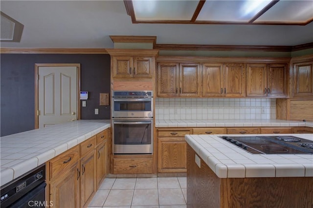 kitchen featuring light tile patterned flooring, black electric cooktop, backsplash, and double oven