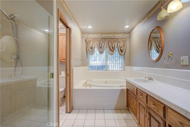 bathroom featuring a shower stall, tile patterned floors, vanity, and a garden tub