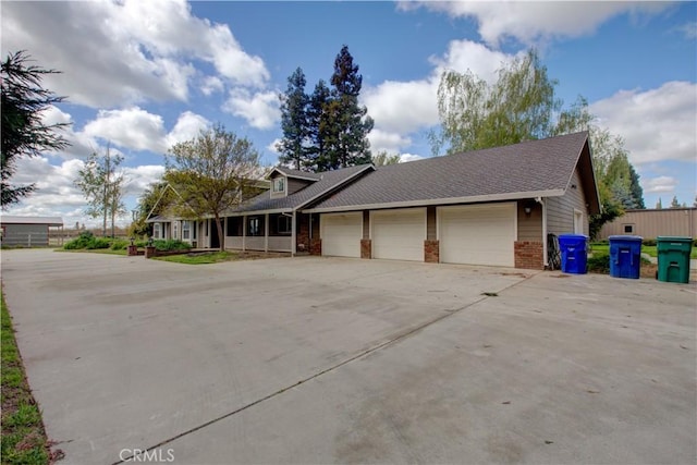 view of front of property with a garage and concrete driveway