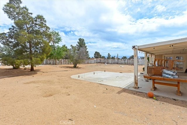 view of yard with a patio area and fence