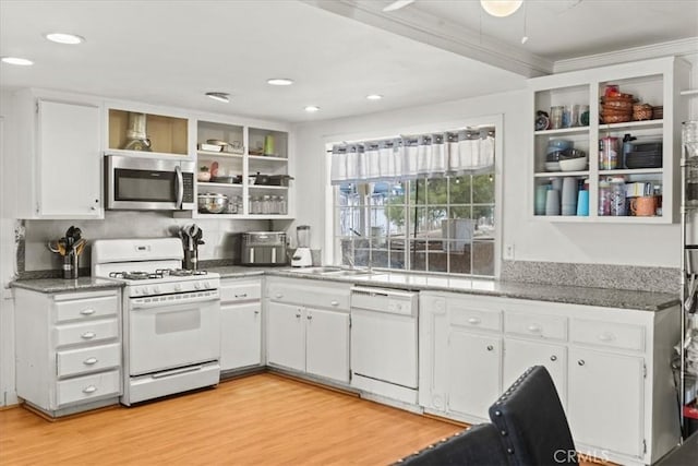 kitchen featuring light wood-type flooring, white appliances, open shelves, white cabinets, and a sink
