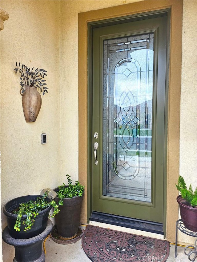 455 Everest Peak, Beaumont, CA 92223 - doorway to property featuring stucco siding