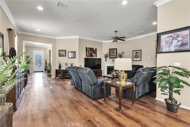 455 Everest Peak, Beaumont, CA 92223 - living room with ceiling fan, a fireplace, visible vents, recessed lighting, and wood finished floors