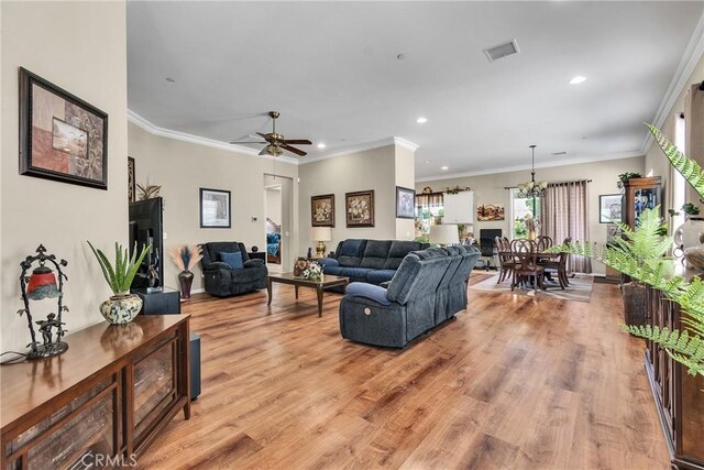 455 Everest Peak, Beaumont, CA 92223 - living area with visible vents, baseboards, recessed lighting, light wood finished floors, and ceiling fan with notable chandelier