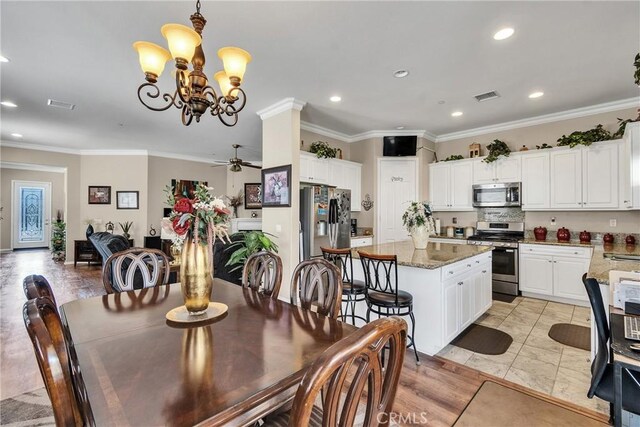 455 Everest Peak, Beaumont, CA 92223 - dining room with recessed lighting, visible vents, ceiling fan with notable chandelier, and crown molding